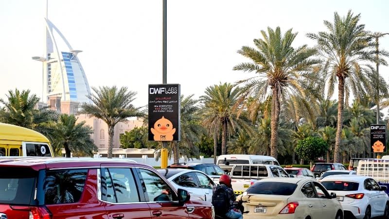 Lamppost banner advertising on Jumeirah Beach Road, Dubai, UAE